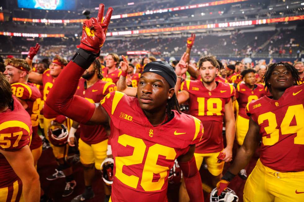 Southern California linebacker Elijah Newby (26) celebrates winning the Vegas Kickoff Classic N ...