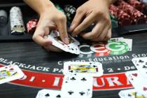 Marvin Ly practices dealing blackjack at the CEG Dealer School in Las Vegas in April 2021. (Rac ...