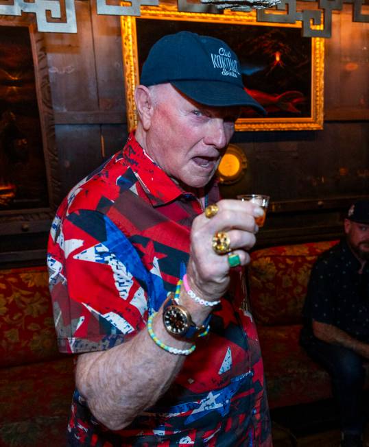 Beach Boys legend Mike Love, center, has a shot of his Club Kokomo Spirits rum before receivin ...