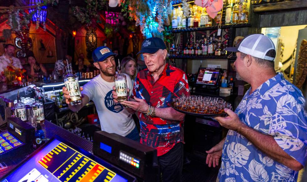 Beach Boys legend Mike Love, center, Brian, left, and Mike Jr., after pouring some of their Clu ...