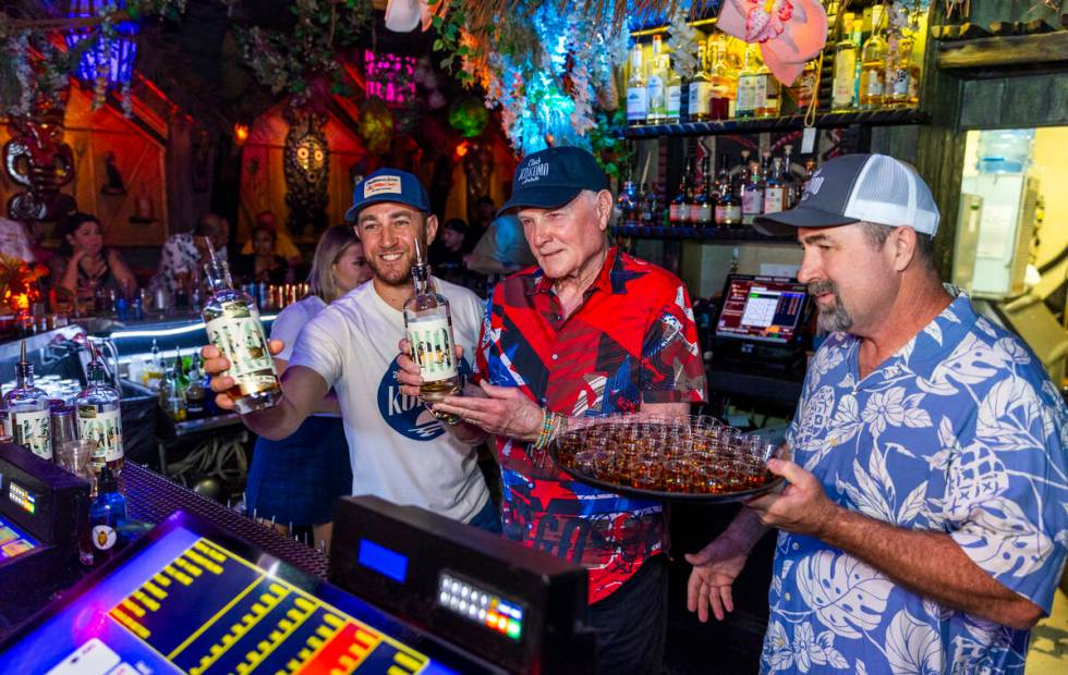 Beach Boys legend Mike Love, center, Brian, left, and Mike Jr., after pouring some of their Clu ...