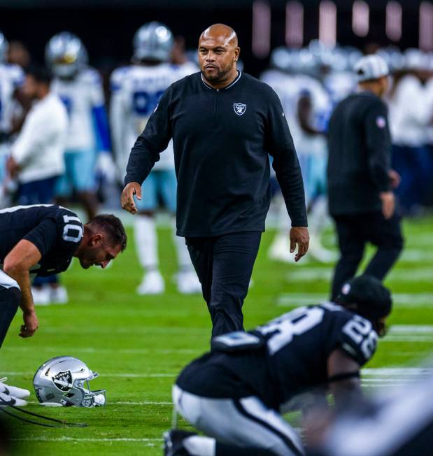 Raiders head coach Antonio Pierce walks amongst this players as they face the Dallas Cowboys fo ...