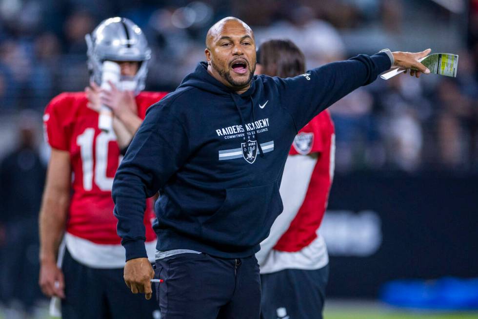 Raiders head coach Antonio Pierce directs players during an open practice at Allegiant Stadium ...