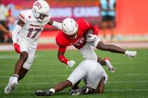 Houston defensive back Bryan Massey (22) returns a kick against UNLV during the first half of a ...