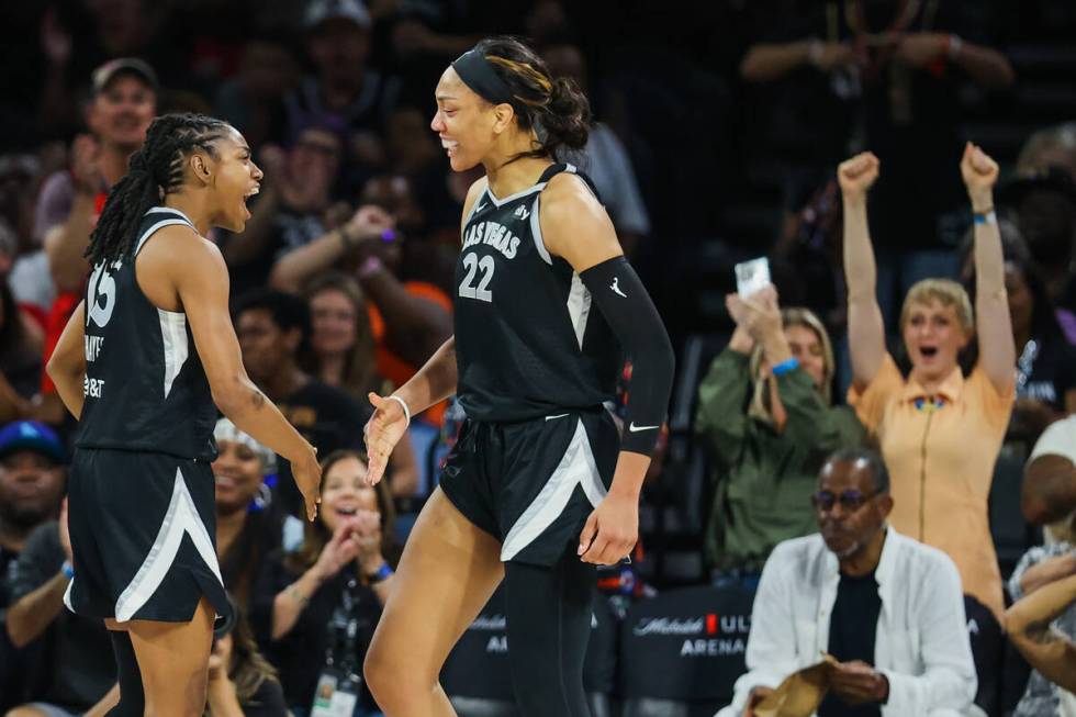 Aces center A'ja Wilson (22) and teammate Tiffany Hayes (15) celebrate during a WNBA basketball ...