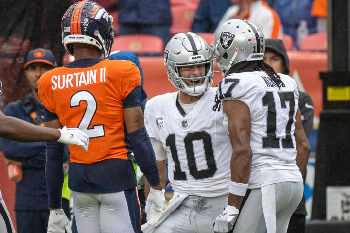 Raiders quarterback Jimmy Garoppolo (10) celebrates the team’s win with wide receiver Da ...