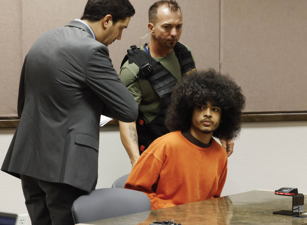 Treavion Randolph appears in court with his attorney Daniel Martinez, left, during a hearing at ...