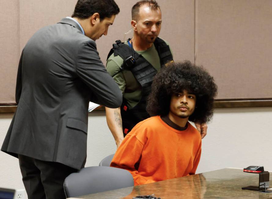 Treavion Randolph appears in court with his attorney Daniel Martinez, left, during a hearing at ...