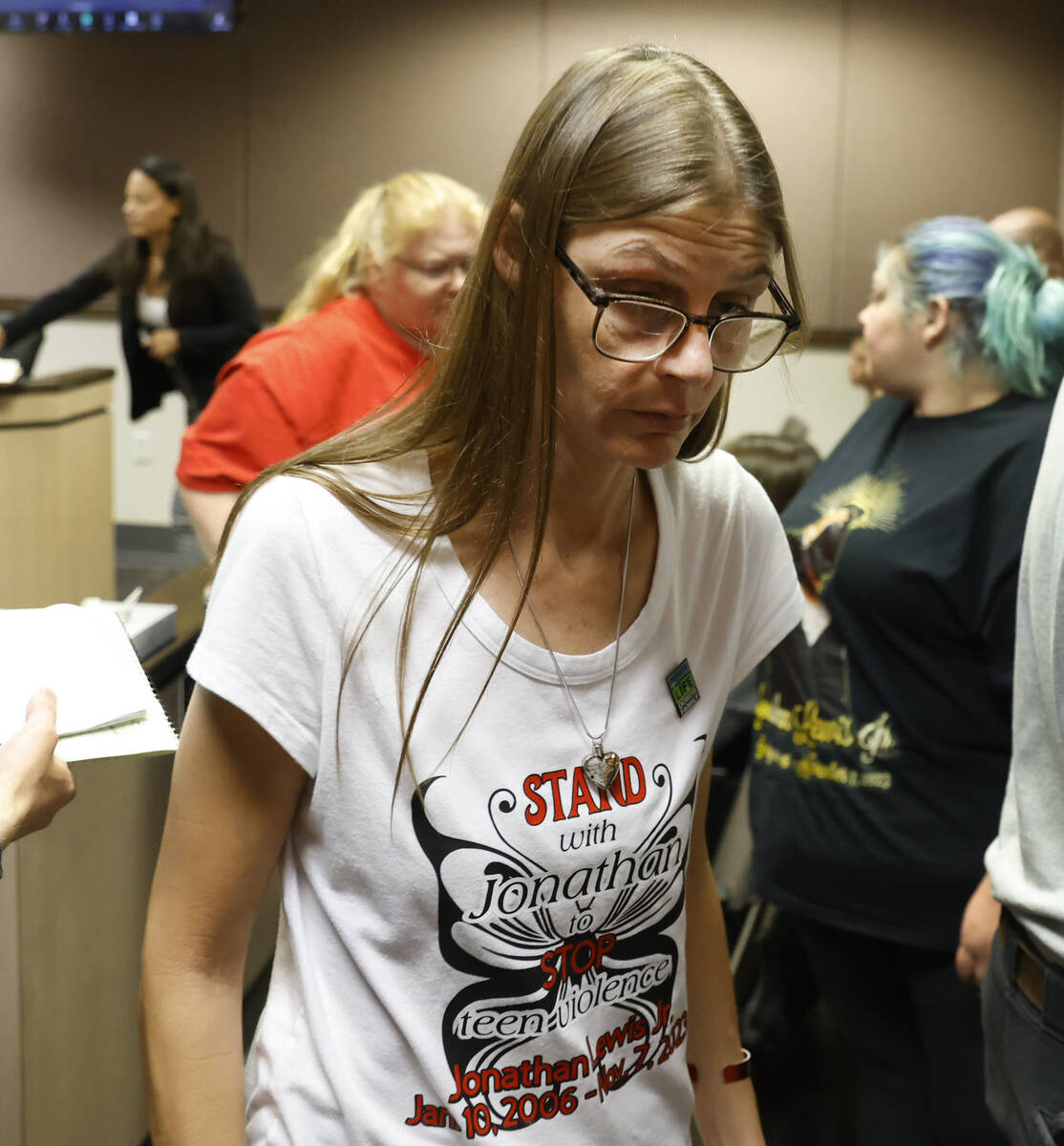 Mellisa Ready, the mother of Jonathan Lewis, wearing a "Stand with Jonathan" T-shirt, leaves Cl ...