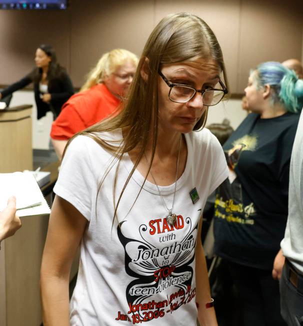 Mellisa Ready, the mother of Jonathan Lewis, wearing a "Stand with Jonathan" T-shirt, leaves Cl ...