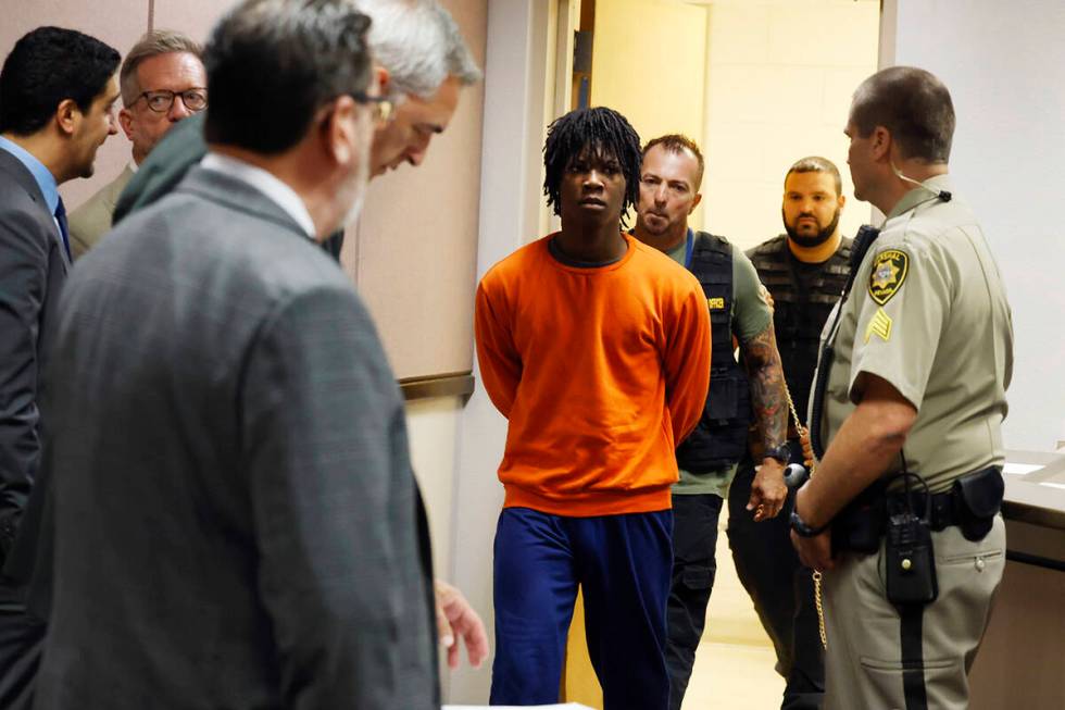 Dontral Beaver is led into Clark County Family Court during a hearing on Tuesday, Sept. 3, 2024 ...