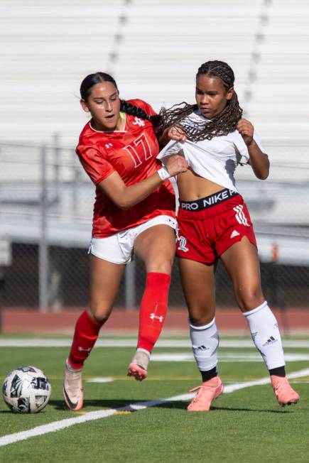 Arbor View senior Kate Oliva (17) and Liberty’s Madalynn Smith (14) compete for the ball ...