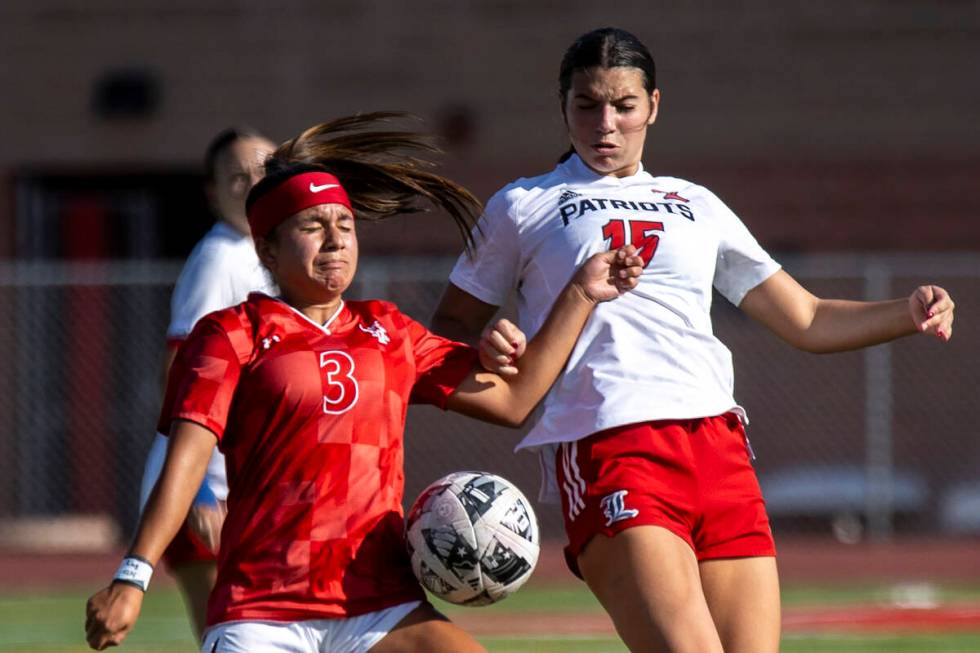 Arbor View sophomore Danielle Morales (3) and Liberty defender Ava Hutt (15) compete during the ...