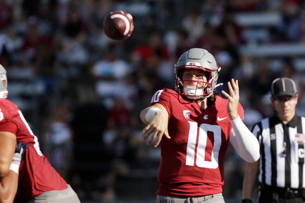 Washington State quarterback John Mateer throws a pass during the second half of an NCAA colleg ...