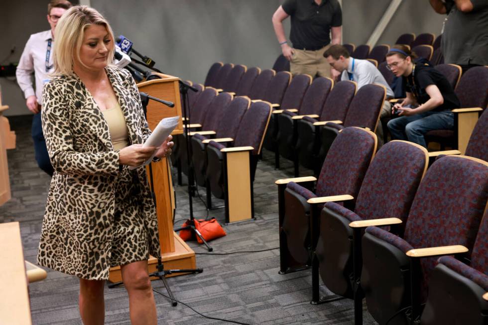 Henderson Mayor Michelle Romero walks away after talking to the news media at City Council cham ...