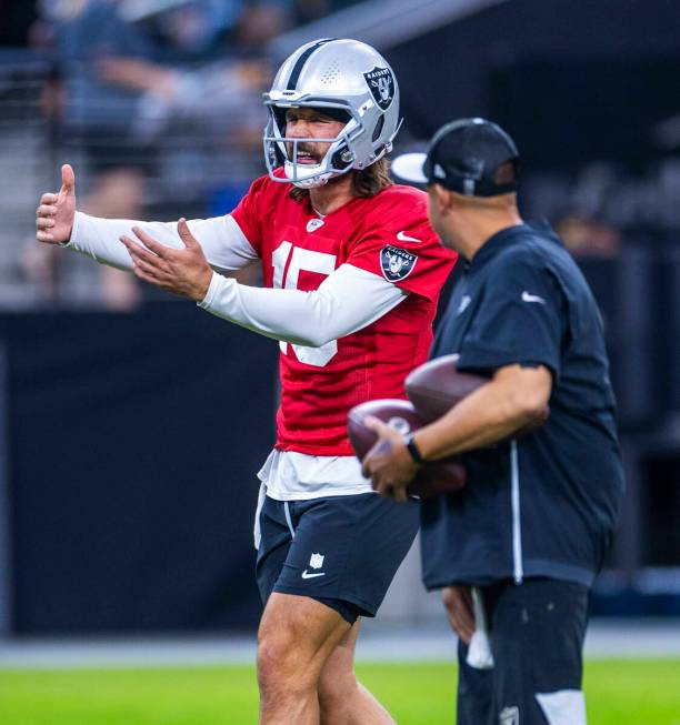 Raiders quarterback Gardner Minshew (15) directs a teammate on a play during an open practice a ...