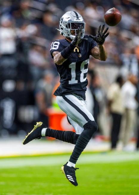 Raiders cornerback Jack Jones (18) catches a pass as they face the Dallas Cowboys for their NFL ...