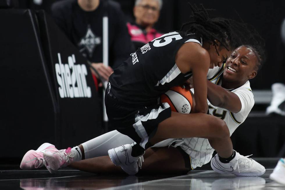 Las Vegas Aces guard Tiffany Hayes (15) and Chicago Sky forward Michaela Onyenwere struggle for ...