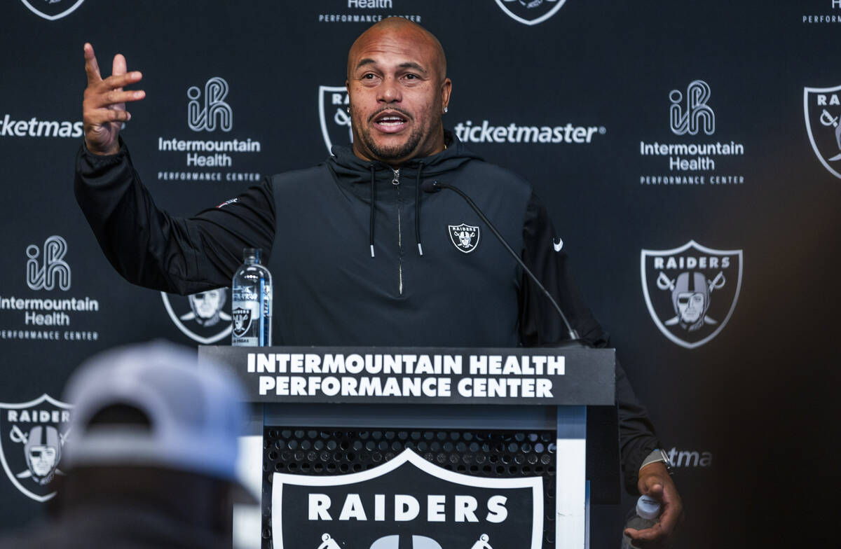 Raiders head coach Antonio Pierce answers a media question before practice at the Intermountain ...