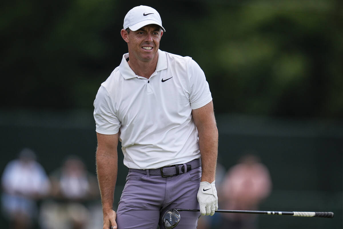 Rory McIlroy, of Northern Ireland, watches his ball on the eighth hole during the second round ...