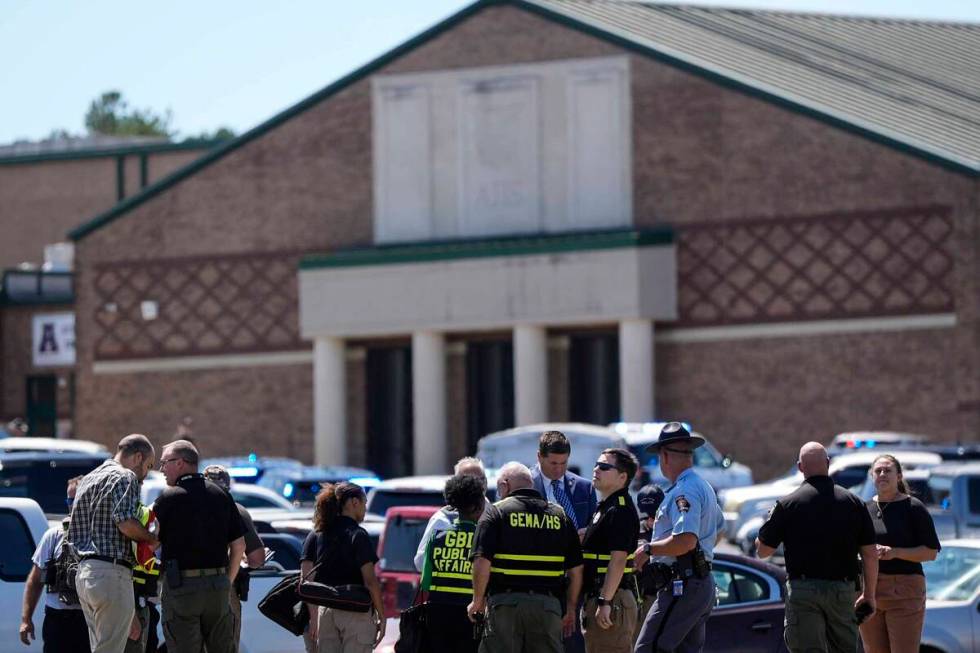 Police gather outside Apalachee High School after a shooting at the school Wednesday, Sept. 4, ...