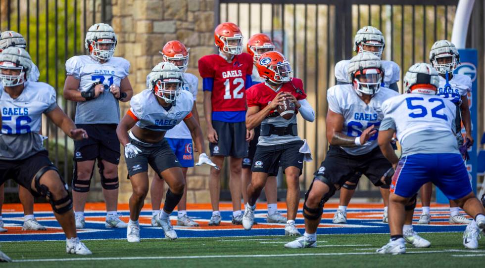 Bishop Gorman quarterback Melvin Spicer IV (#2) steps back in the pocket during football practi ...