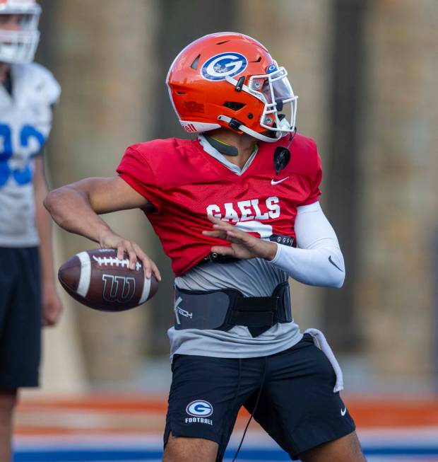 Bishop Gorman quarterback Melvin Spicer IV (#2) eyes a receiver during football practice on Tue ...