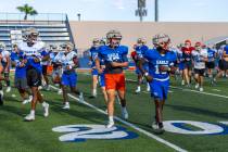 Players run on the field during Bishop Gorman football practice on Tuesday, Sept. 03, 2024, in ...