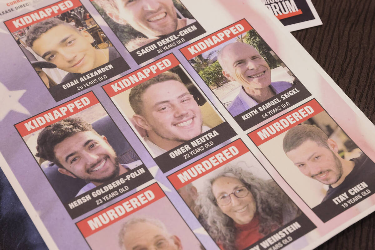 A flyer featuring Omer Neutra, who has been held hostage in Gaza, is shown on a table during an ...