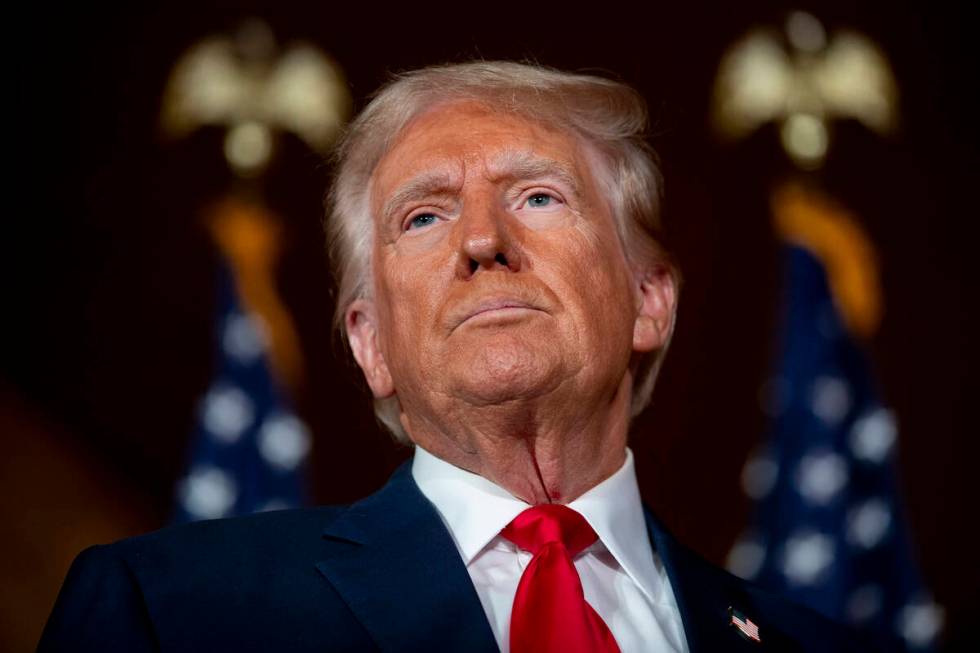 Former President Donald Trump is questioned by the media at Il Toro E La Capra, Friday, Aug. 23 ...