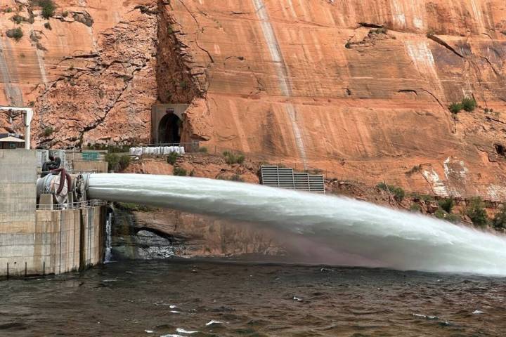 A robotic sandblaster removes the original coating inside the covered river outlet work. The or ...