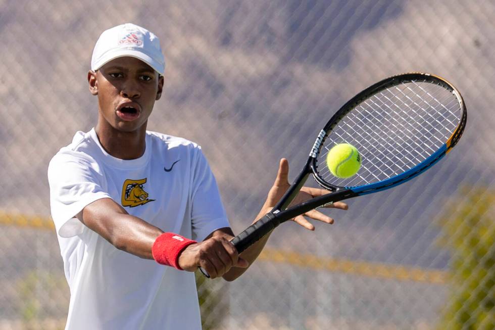 Clark sophomore Marcus Vickers competes during the high school tennis matches against Palo Verd ...