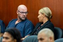 Defendant Ricky Lee Trader speaks with attorney Anna Clark as they prepare for a hearing on an ...