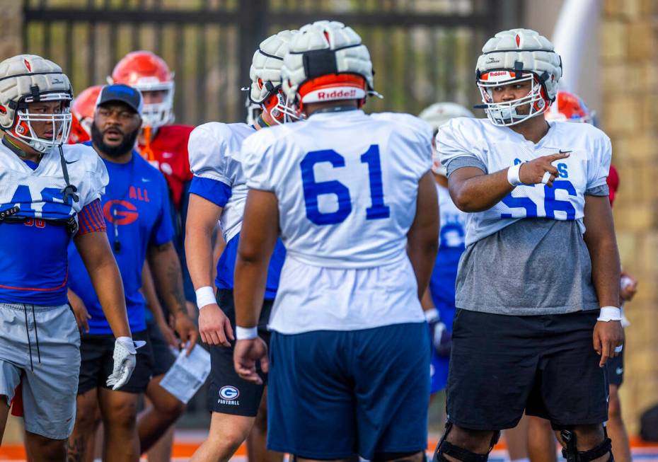 Bishop Gorman outside lineman Doug Utu (56) signals to a teammate during football practice on T ...