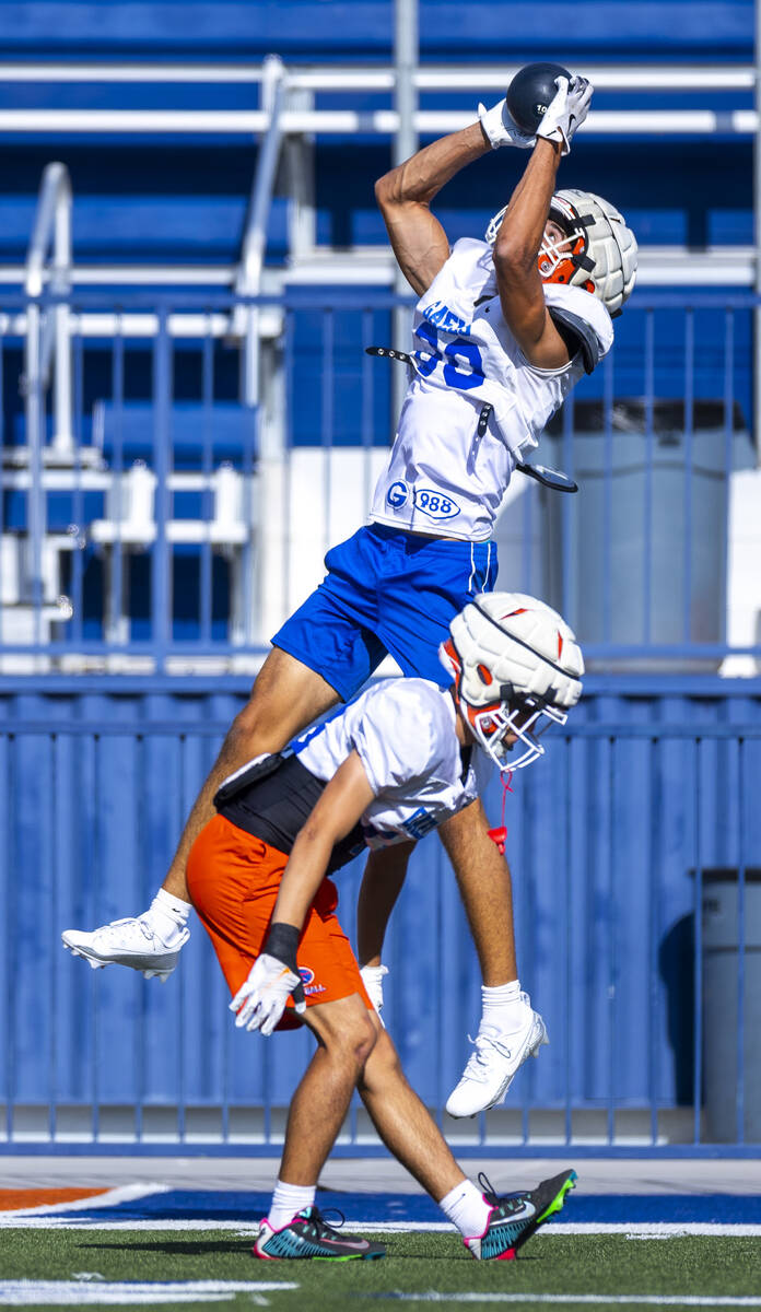 Bishop Gorman wide receiver Derek Meadows (30) elevates for a catch during football practice on ...