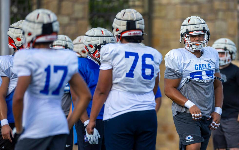 Bishop Gorman outside lineman Alai Kalaniuvalu (55) looks to a teammate during football practic ...