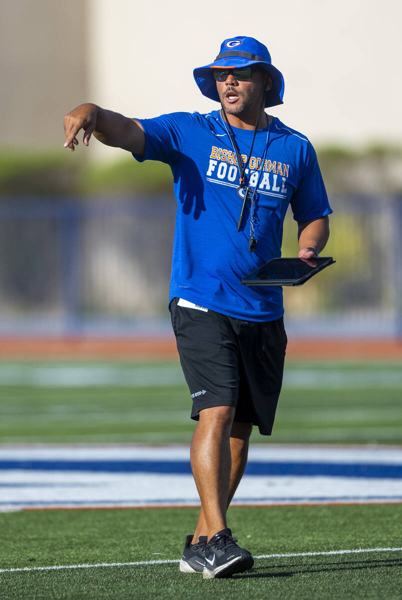 Bishop Gorman head coach Brent Browner directs his players during football practice on Tuesday, ...