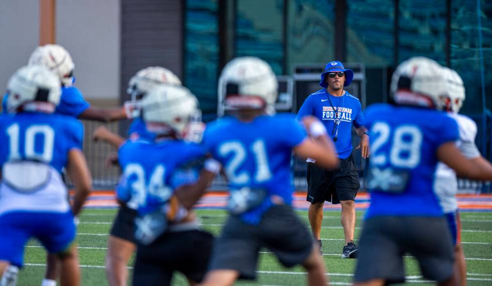 Bishop Gorman head coach Brent Browner observes his players during football practice on Tuesday ...