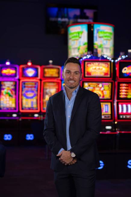 Light & Wonder CEO Matt Wilson stands in front of some of the Las Vegas company's slot machine ...