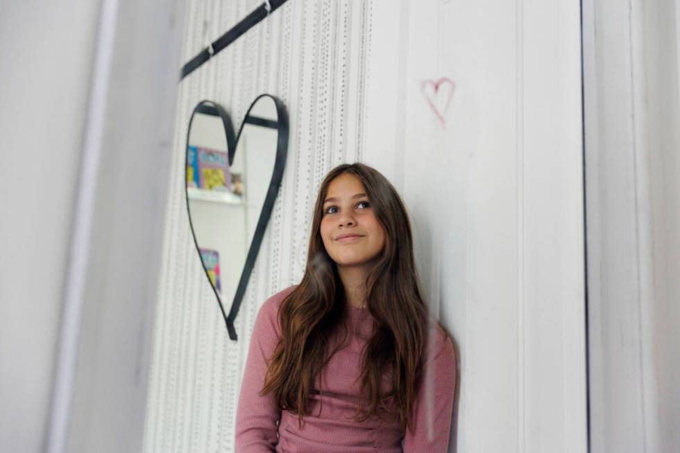 Scarlett Goddard Strahan, 11, poses for a portrait at her home on Tuesday, Aug. 20, 2024, in Sa ...