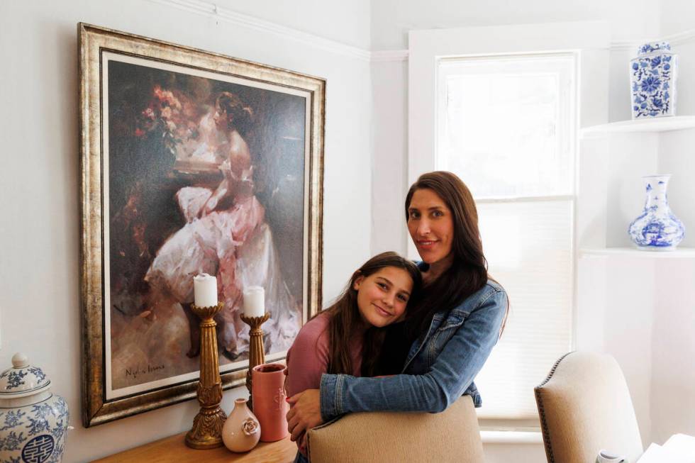 Scarlett Goddard Strahan, 11, and her mom Anna Goddard pose for a portrait at their home on Tue ...