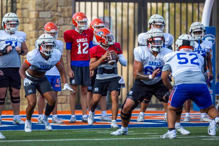 Bishop Gorman quarterback Melvin Spicer IV (#2) steps back in the pocket during football practi ...