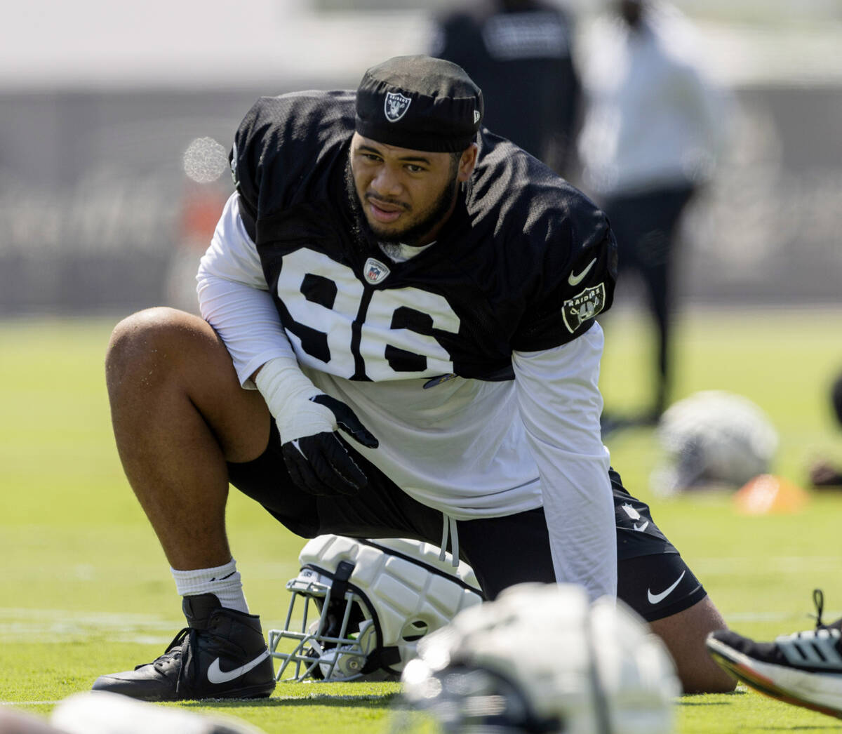 Raiders defensive tackle Jonah Laulu stretches during team practice at the Intermountain Health ...