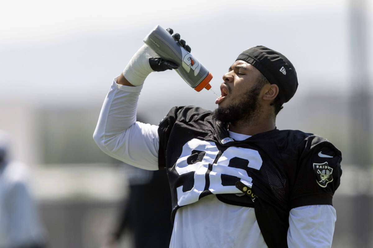 Raiders defensive tackle Jonah Laulu takes a water break during team practice at the Intermount ...