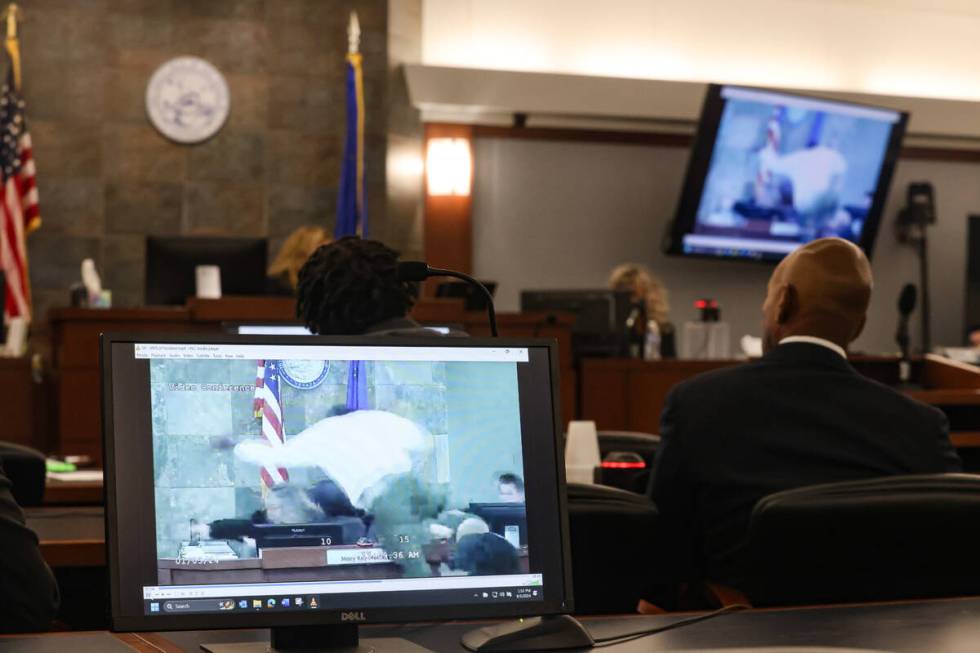 Screens play the moment when Deobra Redden attacked District Judge Mary Kay Holthus during Red ...