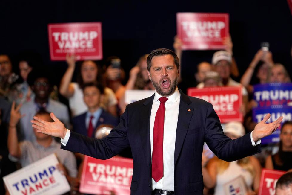 Republican vice presidential nominee Sen. JD Vance, R-Ohio, gestures to supporters at a campaig ...