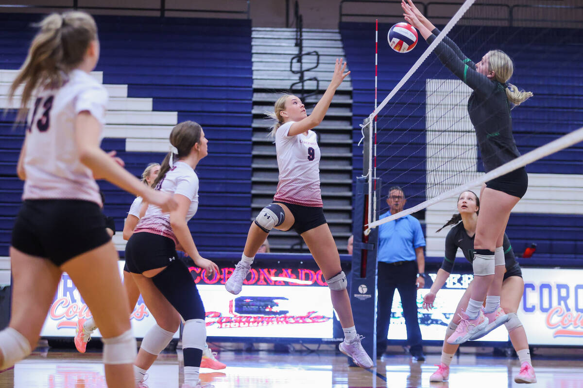 Coronado middle blocker Rachel Purser hits the ball over the net during a volleyball match betw ...