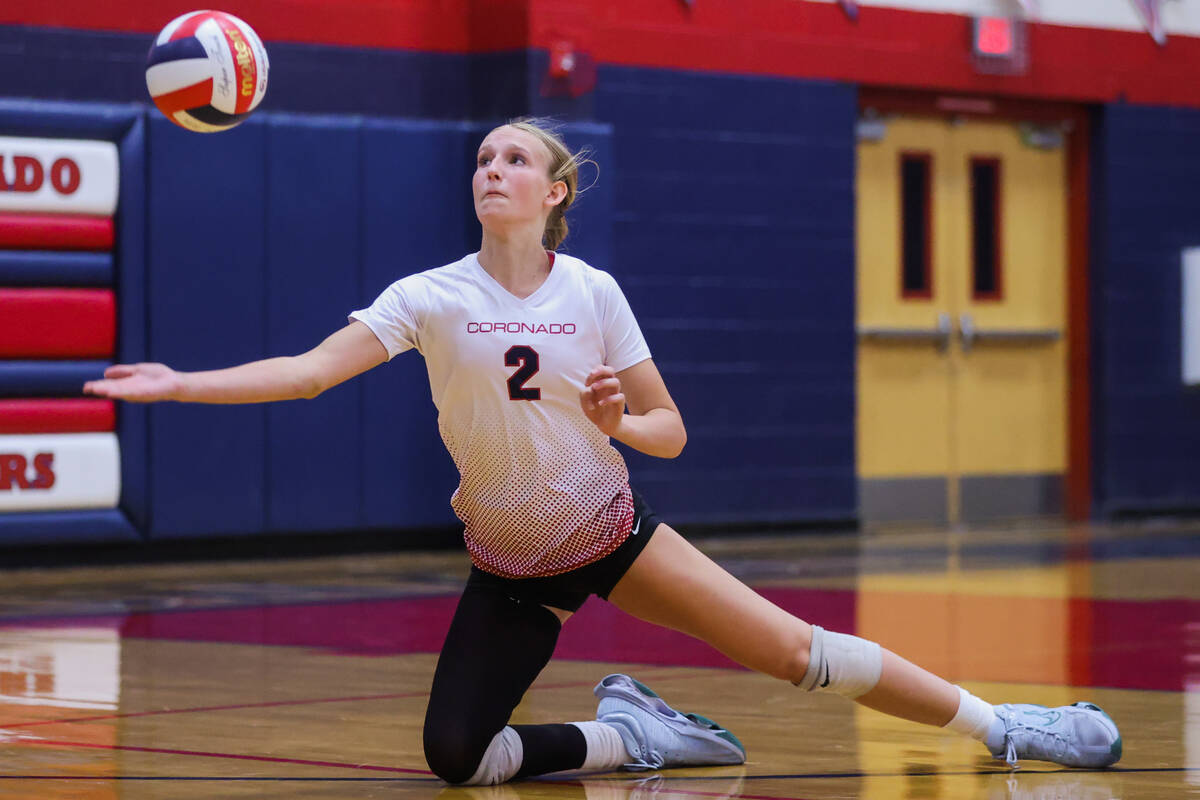 Coronado outside hitter Julie Beckham (2) saves the ball from hitting the floor during a volley ...