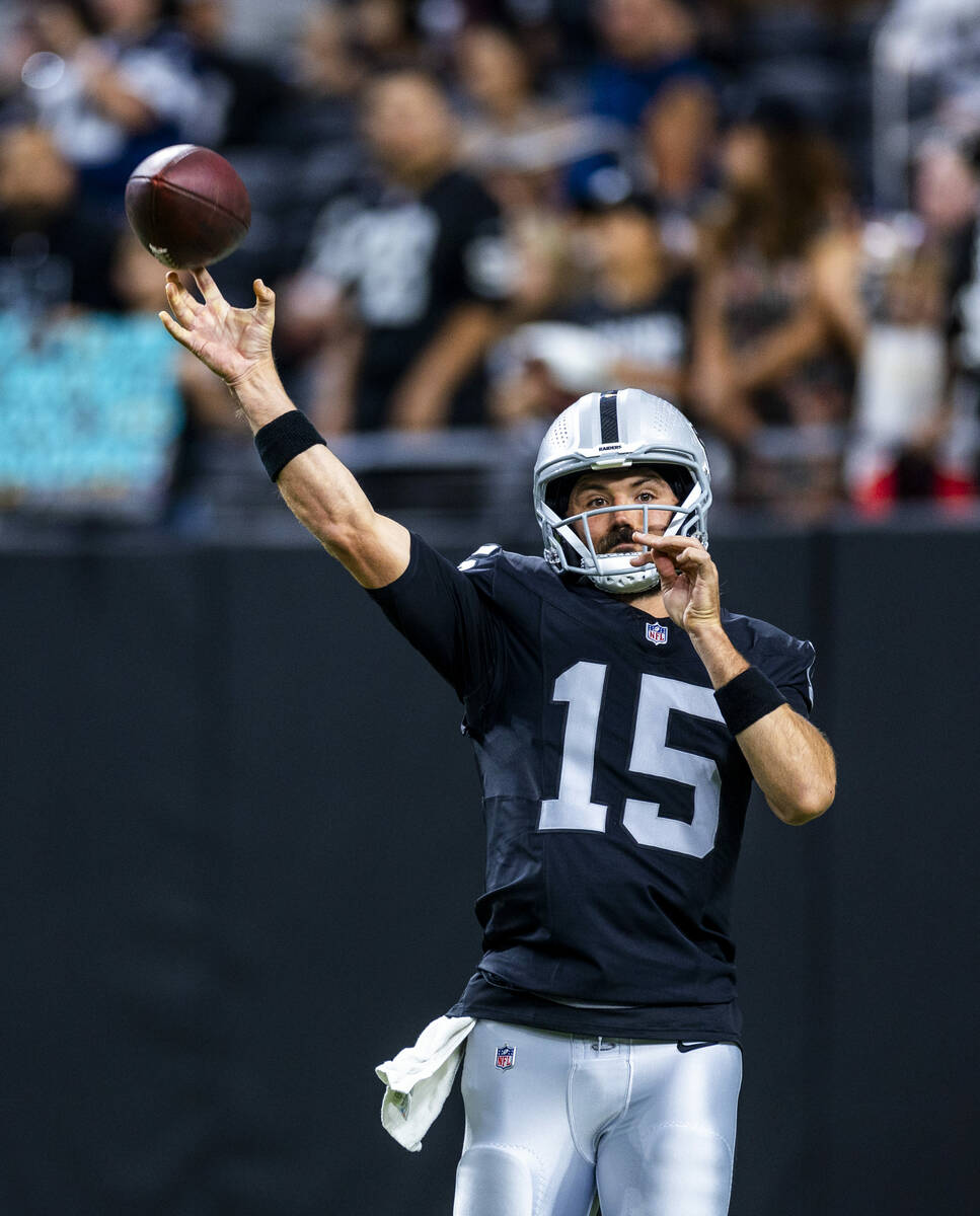 Raiders quarterback Gardner Minshew (15) gets off a pass as they face the Dallas Cowboys for th ...