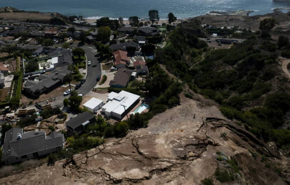 An aerial view shows a neighborhood damaged by ongoing landslides in Rancho Palos Verdes, Calif ...